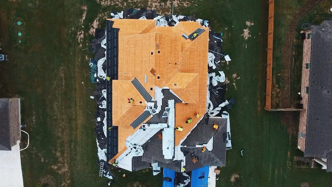 Aerial view of a roof stripped to bare decking during full tear-off