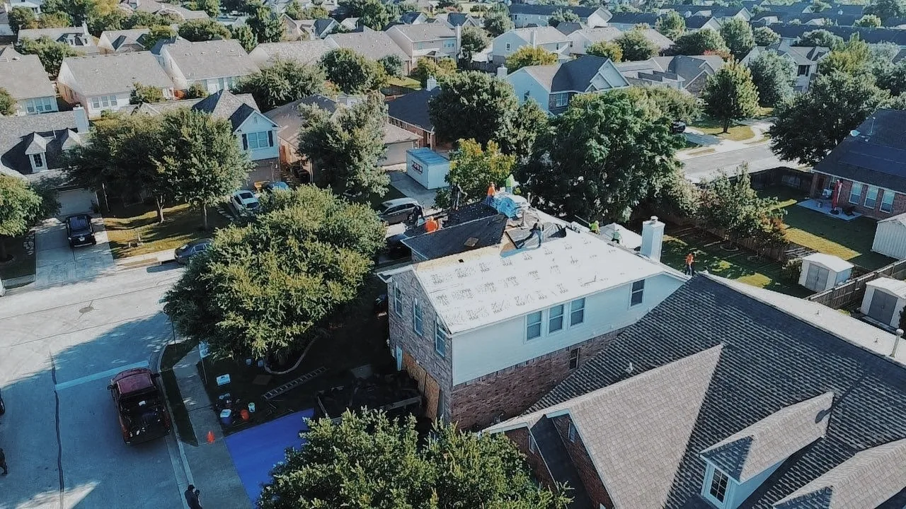 Aerial view of a suburban home roof replacement in the Austin metro